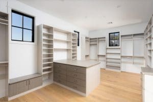 CUSTOM CLOSET SYSTEM IN TWO TONE FINISH BY AUSTIN-MORGAN CLOSETS