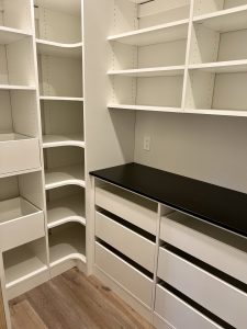 CUSTOM WALK-IN PANTRY adjustable shelving and pull-out drawers designed by Austin-Morgan Closets